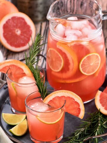 {title:2:5} of Paloma {title:2:1}s with grapefruit wedges and lime wedges
